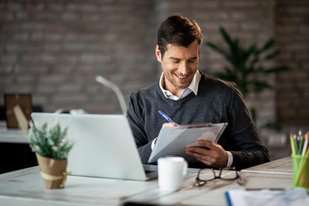 tax advisor in Glasgow working in office signing form